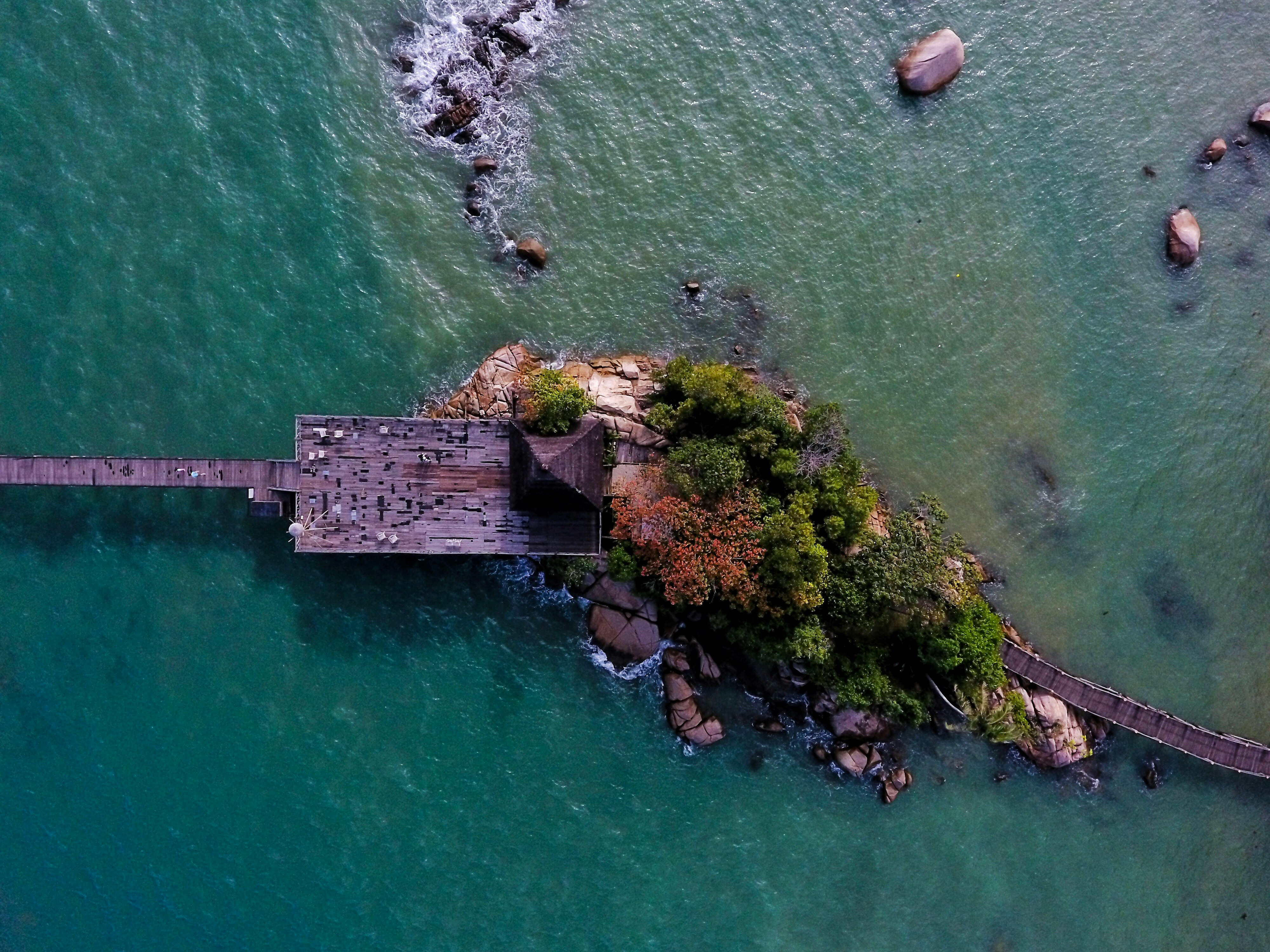 high angle photography of island with sea